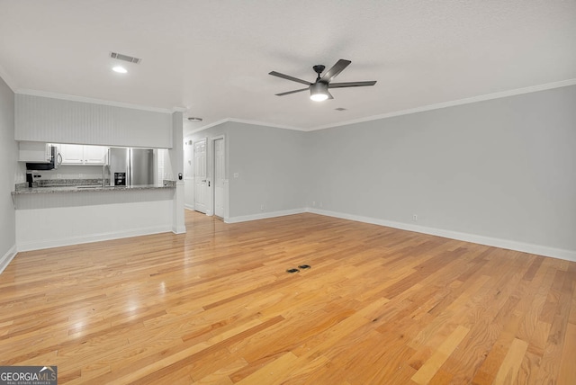 unfurnished living room with light wood-type flooring, ceiling fan, crown molding, and sink