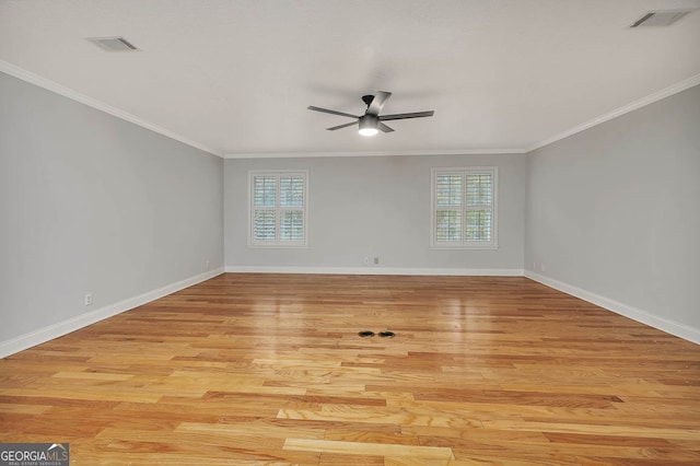 unfurnished room with plenty of natural light, ornamental molding, and light hardwood / wood-style flooring