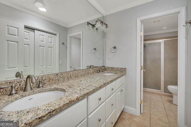 bathroom featuring vanity, a shower with door, tile patterned flooring, toilet, and ornamental molding