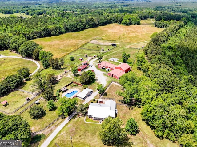 birds eye view of property with a rural view