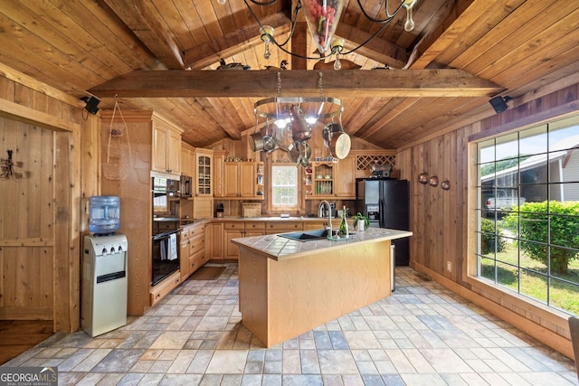 kitchen featuring wooden ceiling, tile countertops, wooden walls, and black appliances