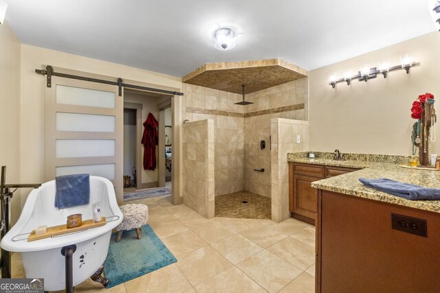 bathroom featuring plus walk in shower, tile patterned flooring, and vanity