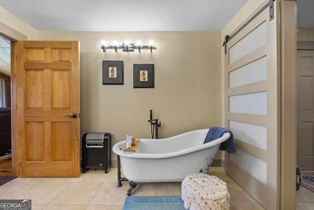 bathroom with tile patterned flooring and a bathtub