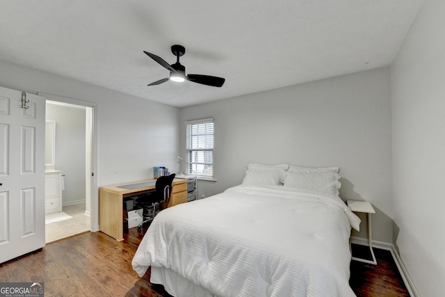 bedroom featuring ensuite bath, ceiling fan, and dark wood-type flooring