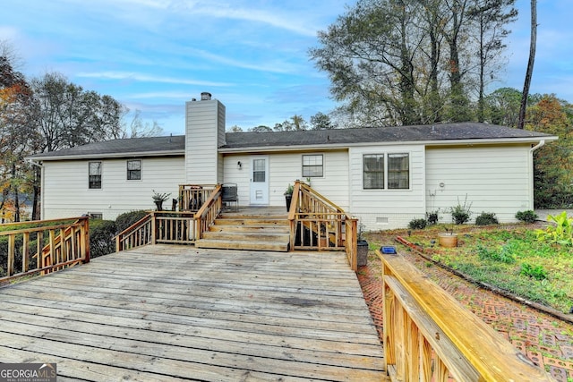 rear view of house with a wooden deck