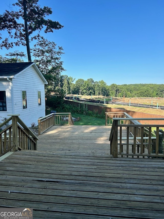 wooden terrace with a rural view