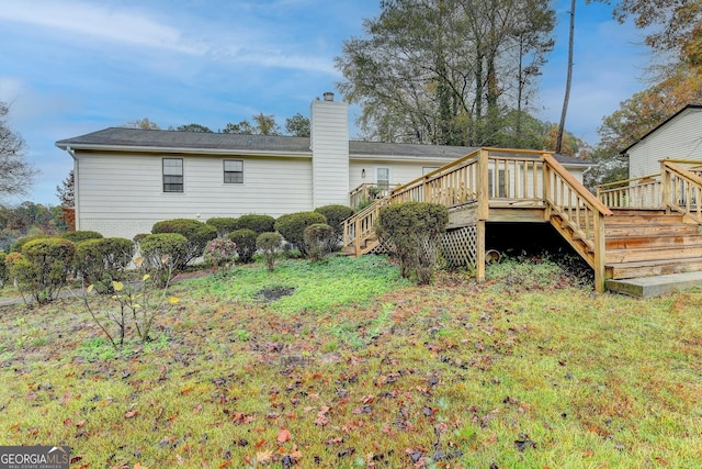 rear view of property with a deck