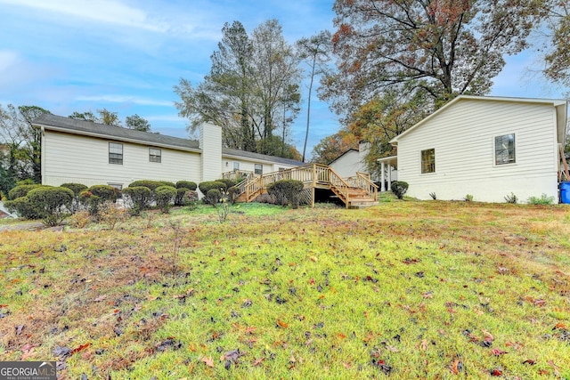 view of yard with a wooden deck