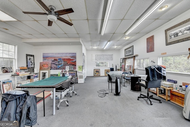 rec room featuring carpet flooring, a paneled ceiling, and ceiling fan