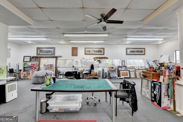 recreation room featuring carpet, a paneled ceiling, and ceiling fan