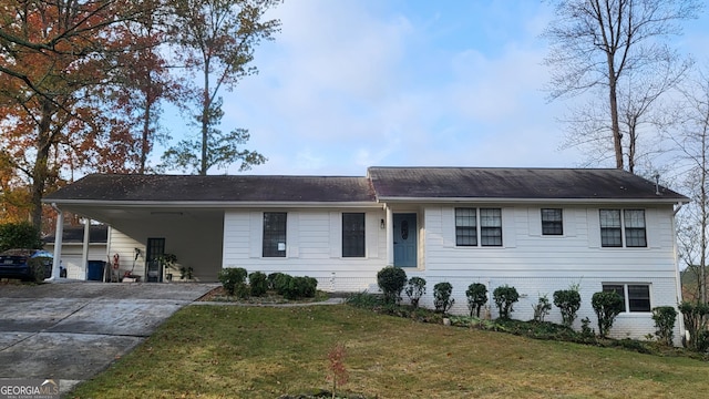 single story home with a front yard and a carport