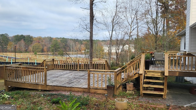 wooden terrace featuring a trampoline