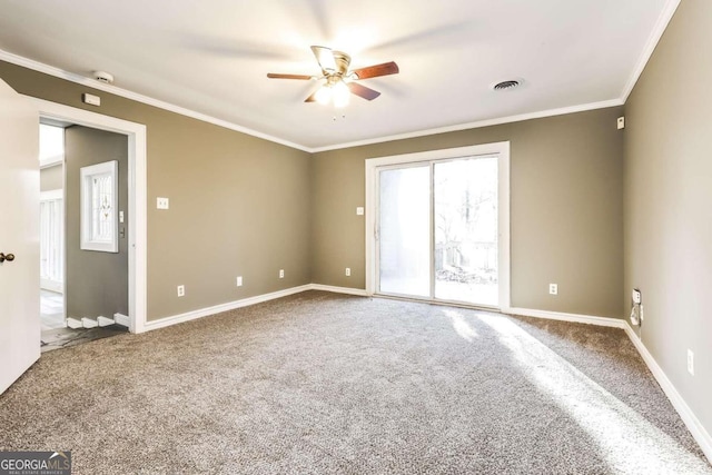 carpeted empty room with ceiling fan and ornamental molding