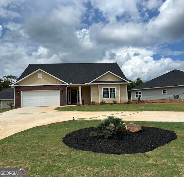 view of front of home featuring a front yard and a garage