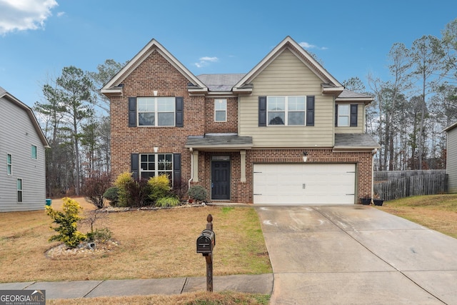 view of front of house with a front lawn and a garage