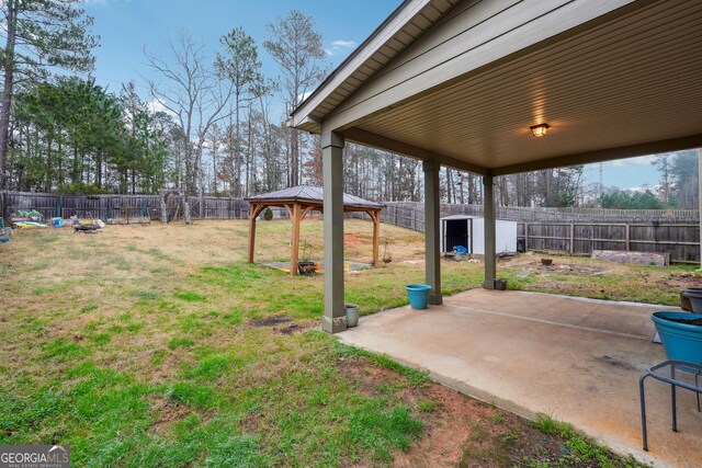 view of yard featuring a gazebo and a shed