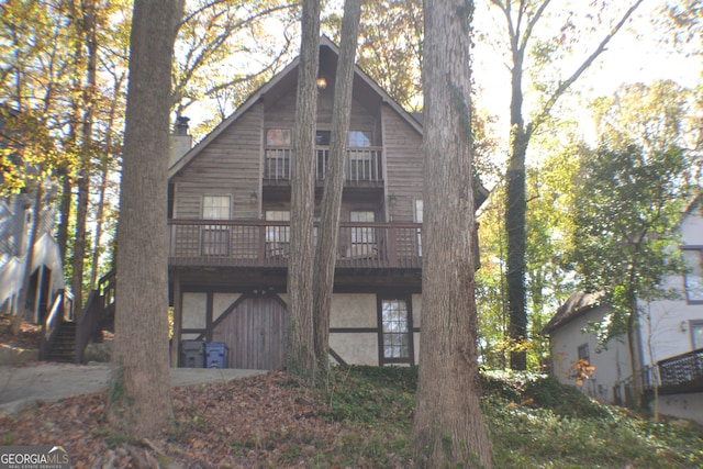 rear view of property with a wooden deck