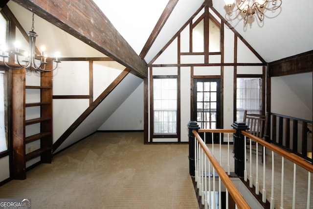 interior space with light colored carpet, lofted ceiling, and an inviting chandelier