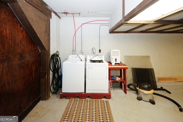 washroom with independent washer and dryer