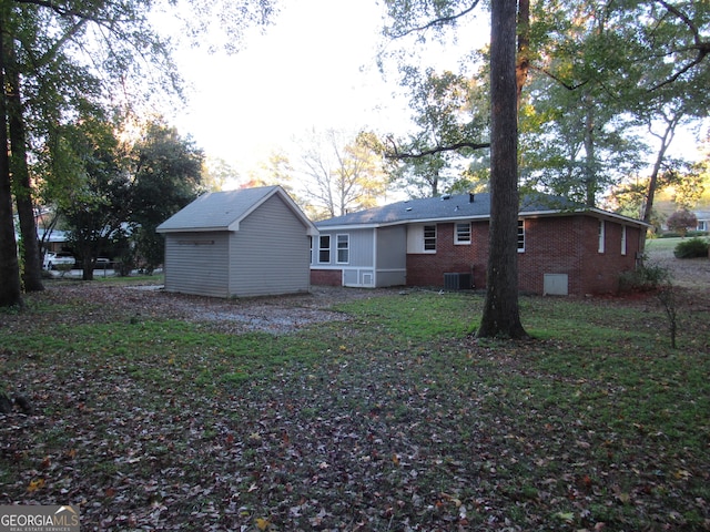 rear view of property with central air condition unit