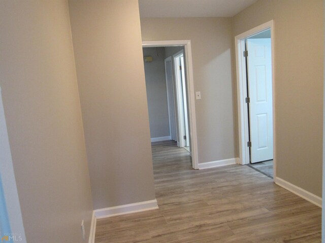 corridor featuring light hardwood / wood-style flooring