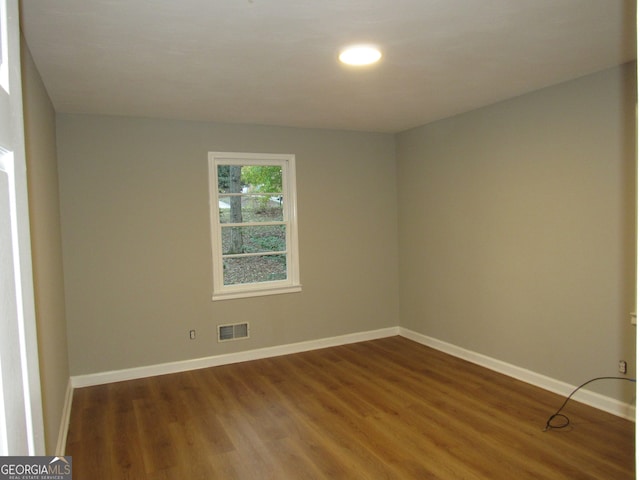 spare room featuring hardwood / wood-style floors