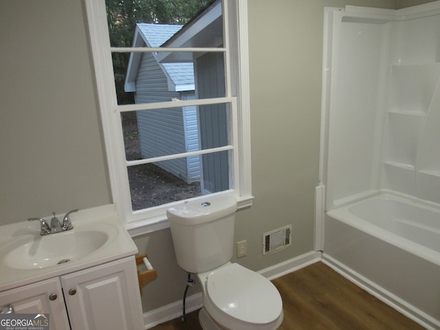 full bathroom featuring wood-type flooring, vanity, toilet, and shower / tub combination