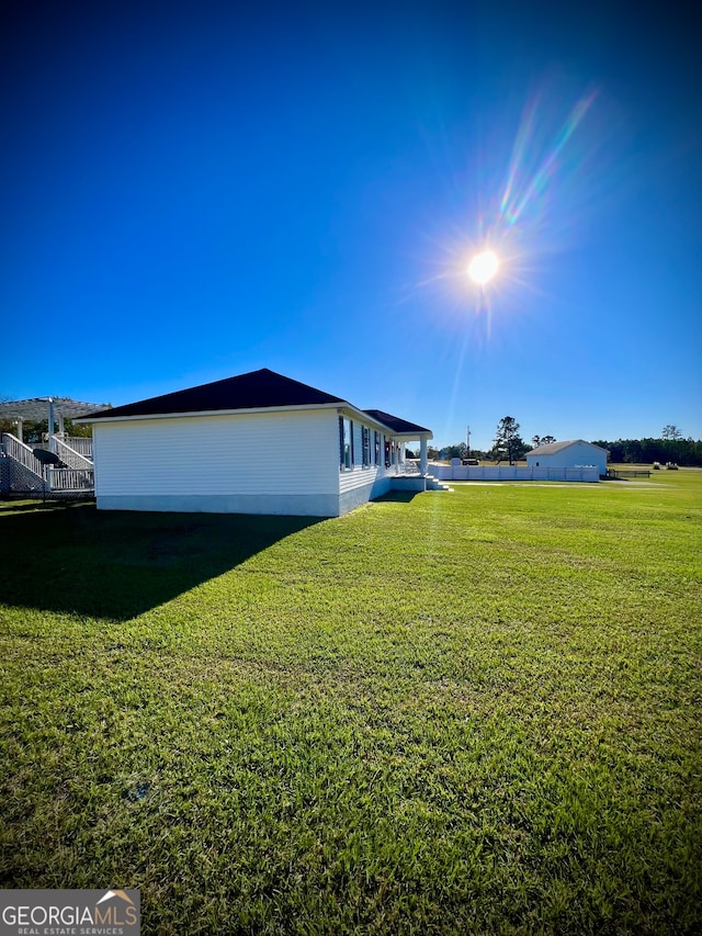 view of home's exterior featuring a yard