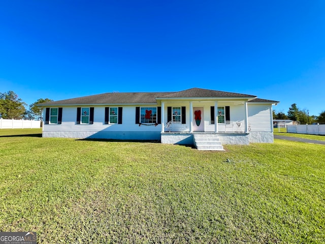 ranch-style home with a front yard and a porch