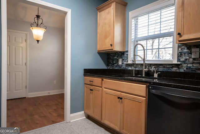 kitchen featuring black dishwasher, dark stone counters, pendant lighting, decorative backsplash, and light wood-type flooring