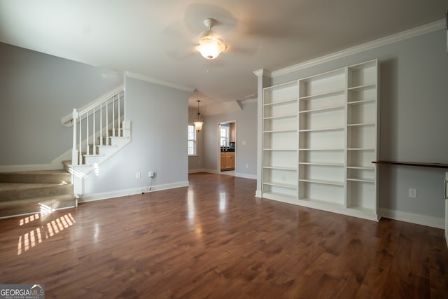 unfurnished living room featuring dark hardwood / wood-style floors, ceiling fan, and ornamental molding