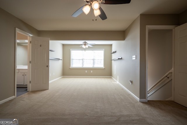 unfurnished bedroom featuring light carpet and ceiling fan