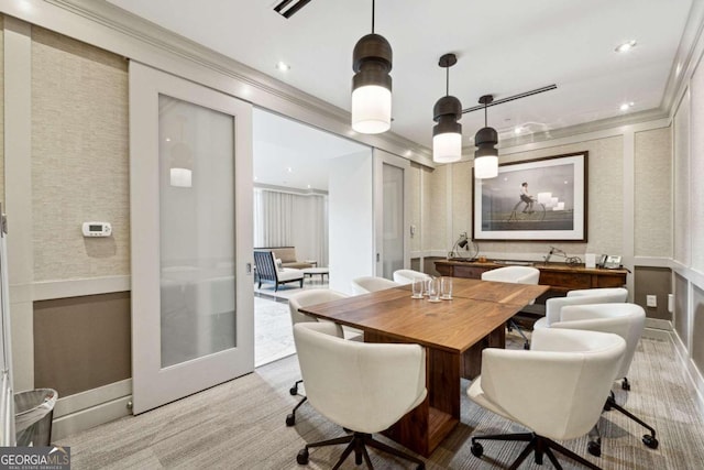 dining room featuring light carpet, french doors, and crown molding