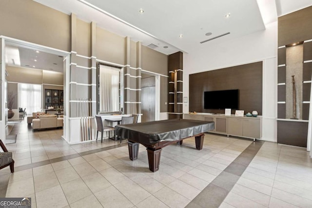 rec room featuring a high ceiling, billiards, and light tile patterned flooring