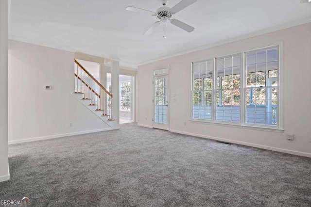 unfurnished living room with ceiling fan, crown molding, carpet, and a healthy amount of sunlight