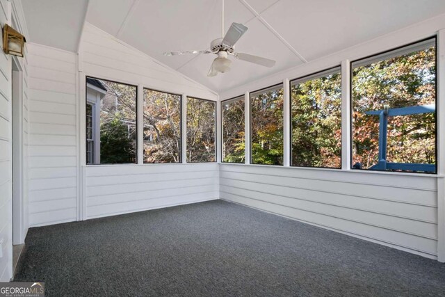 unfurnished sunroom with plenty of natural light, ceiling fan, and lofted ceiling