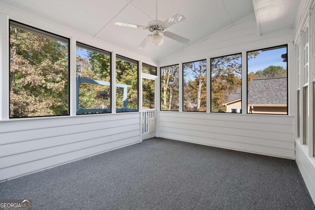 unfurnished sunroom featuring ceiling fan and lofted ceiling