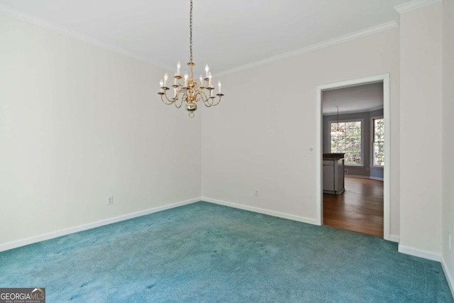 carpeted empty room with a chandelier and ornamental molding