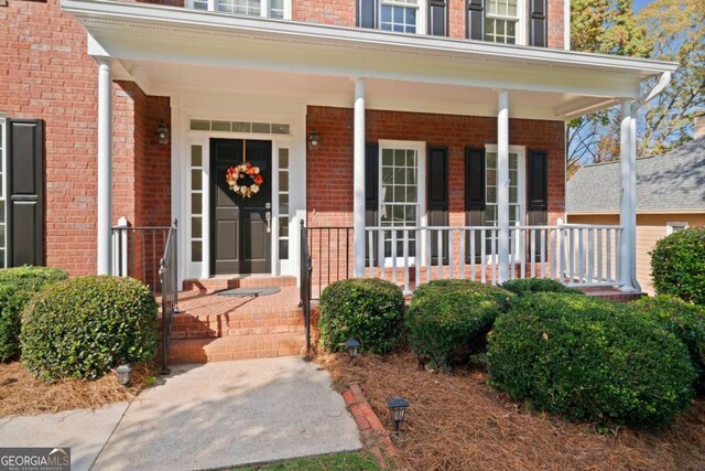 entrance to property with a porch