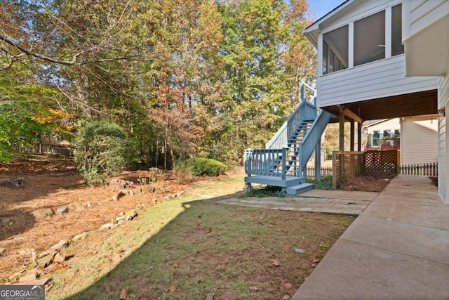 view of yard with a sunroom