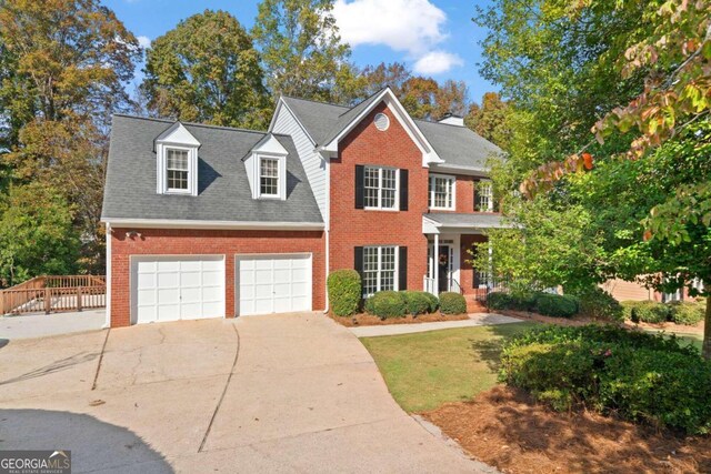 colonial home with a garage