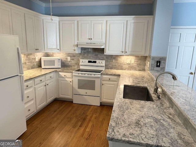 kitchen with white appliances, white cabinets, crown molding, sink, and hardwood / wood-style flooring