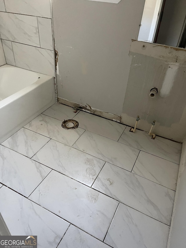 bathroom with a tub to relax in