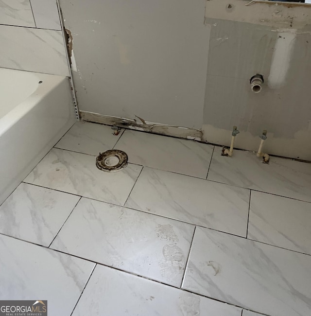 bathroom featuring a tub to relax in