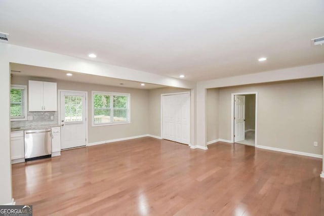 unfurnished living room featuring light hardwood / wood-style floors