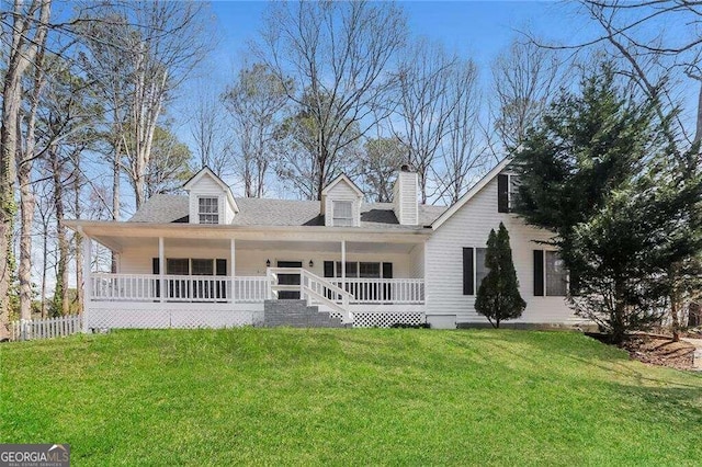 view of front of home featuring covered porch and a front yard