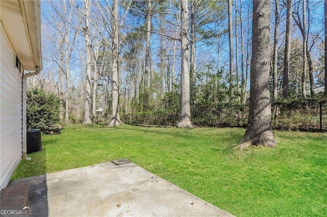 view of yard with a patio area and central air condition unit