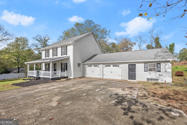 view of front facade with a porch and a garage