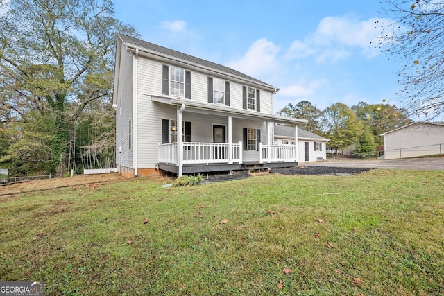 view of front of house with a porch and a front lawn