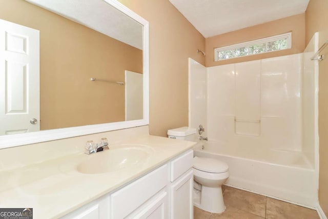 full bathroom with tile patterned floors, vanity, toilet, and shower / washtub combination